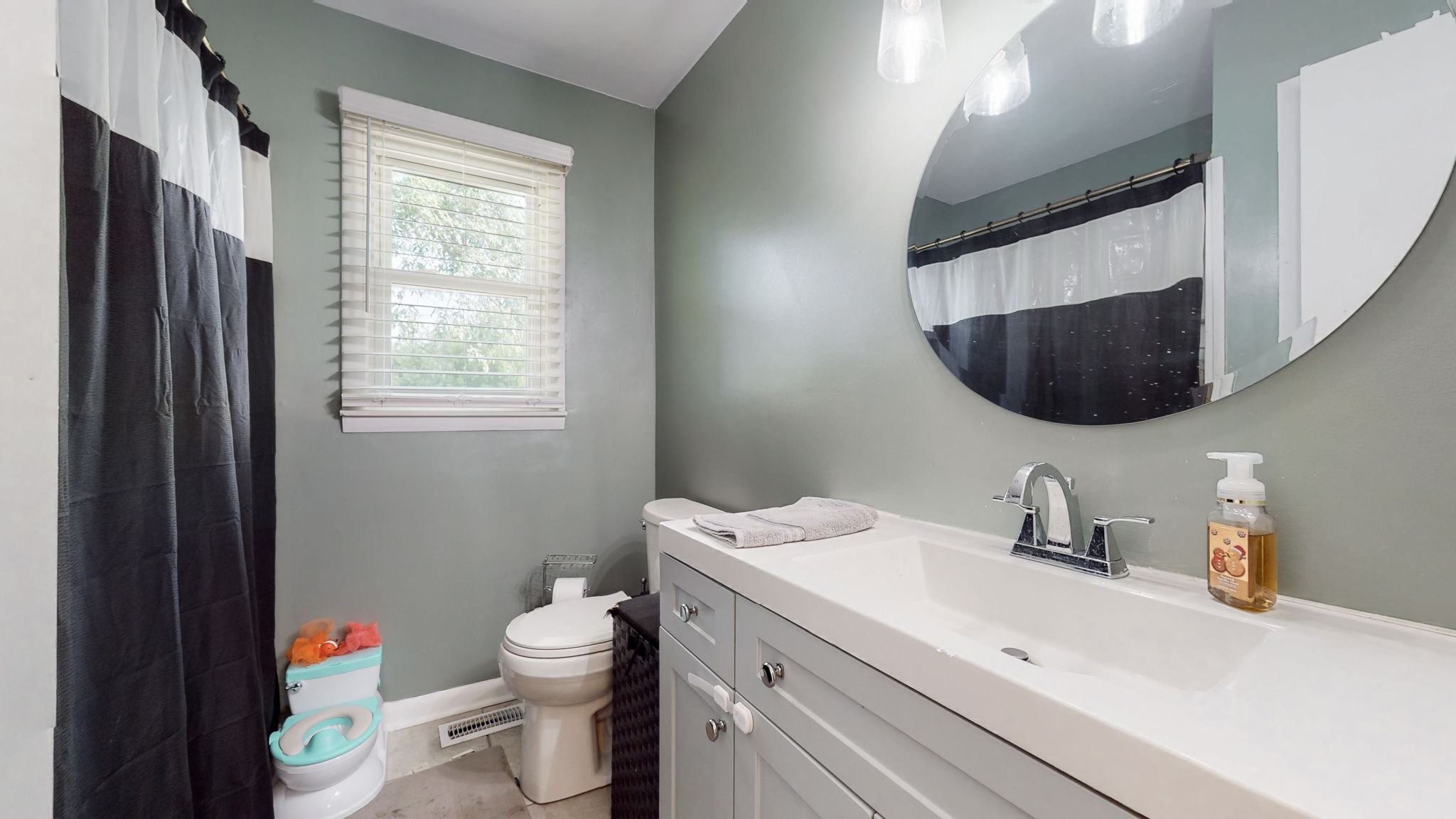 710 Howell Hill Road Flintville, TN 37335 - Photo 20 of 38 a bathroom with a sink toilet and mirror