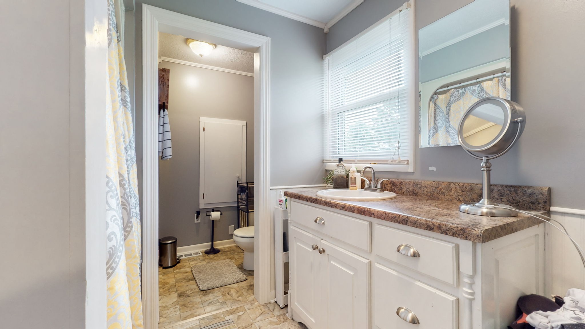710 Howell Hill Road Flintville, TN 37335 - Photo 26 of 38 a en suite bathroom with a granite countertop sink and a mirror