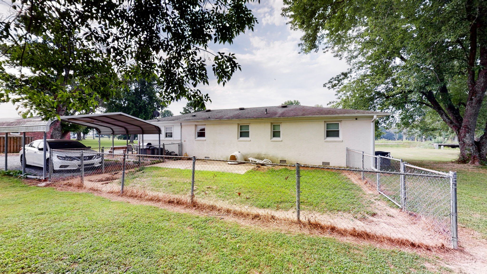 710 Howell Hill Road Flintville, TN 37335 - Photo 31 of 38 a view of a house with backyard and sitting area