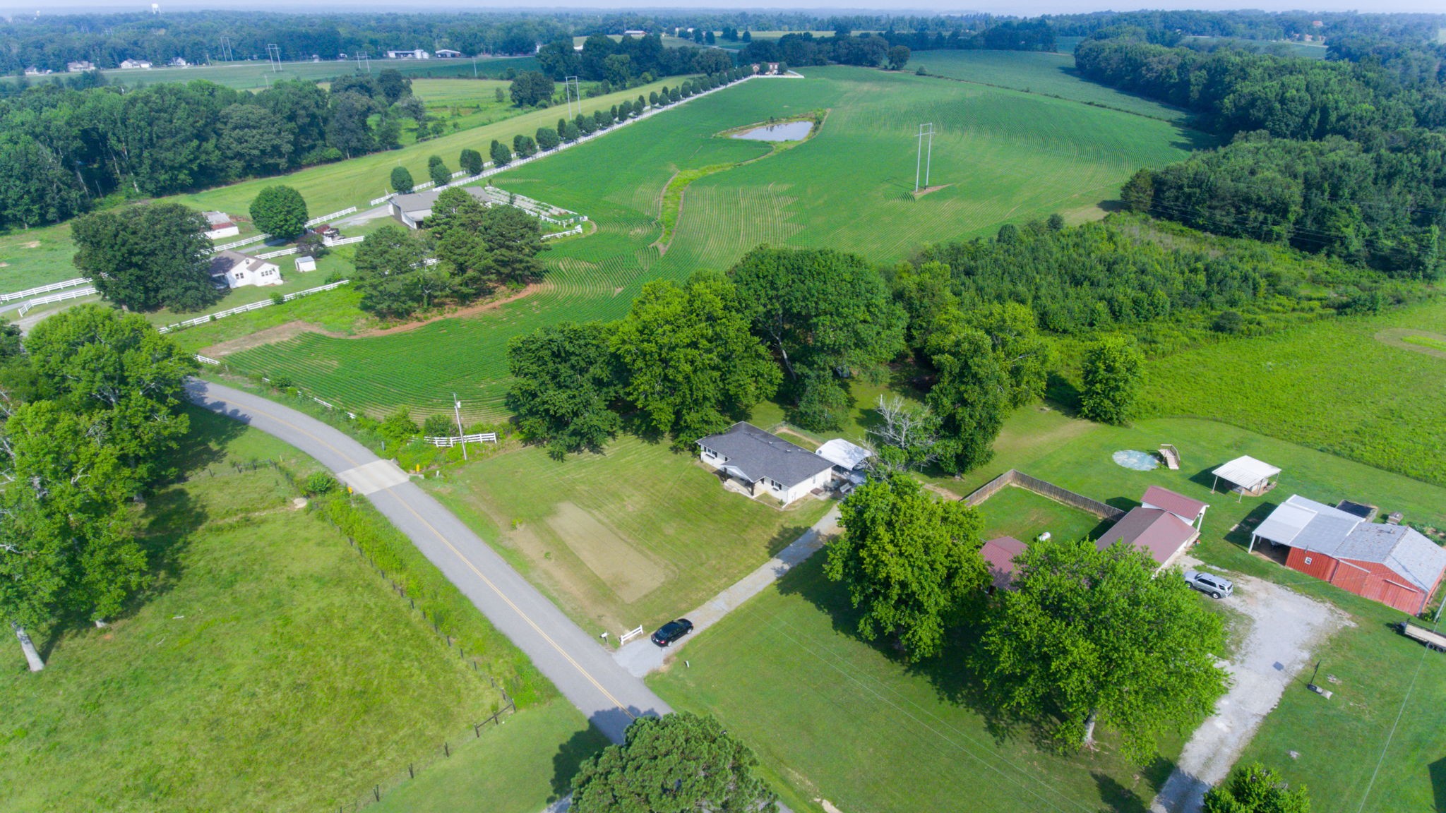 710 Howell Hill Road Flintville, TN 37335 - Photo 36 of 38 an aerial view of green landscape with trees houses and mountain view