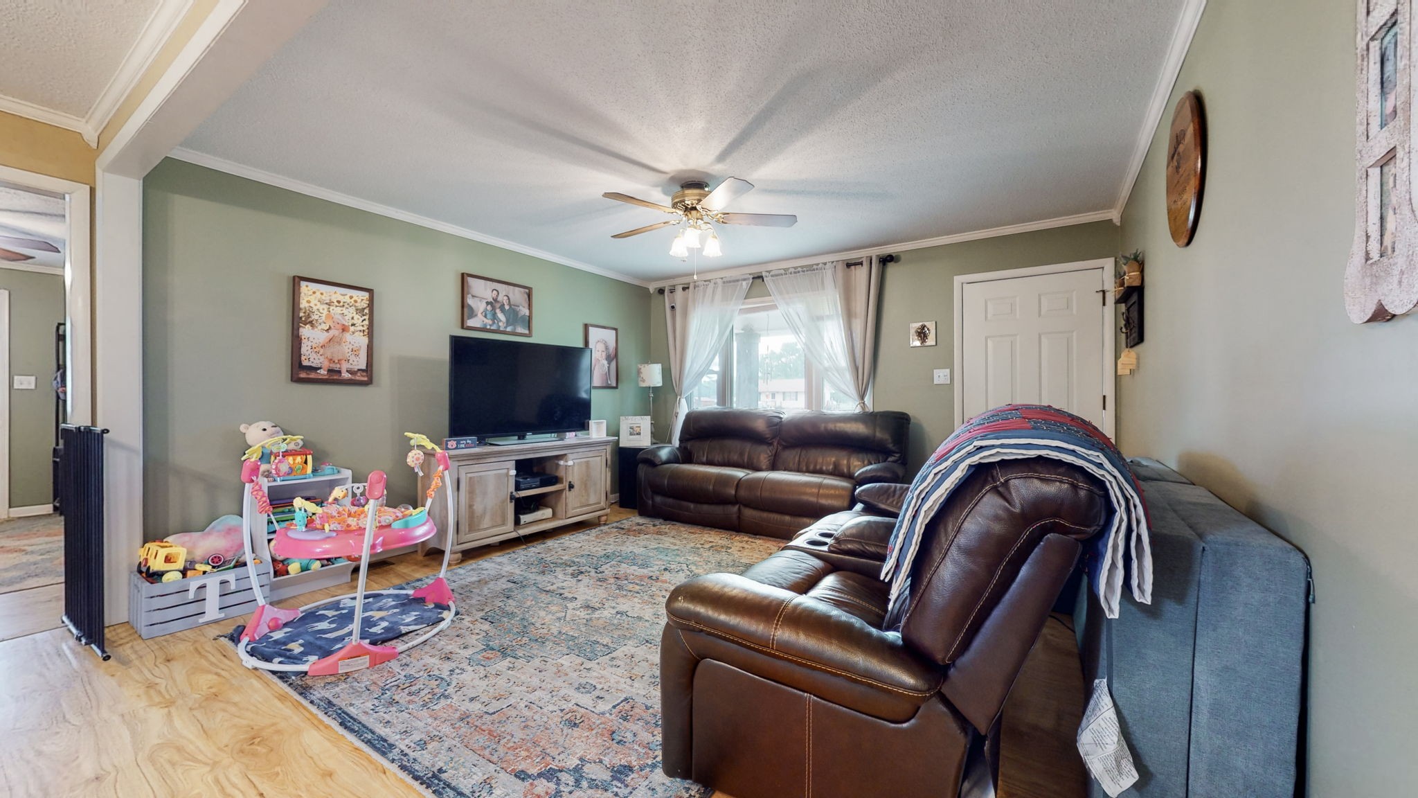 710 Howell Hill Road Flintville, TN 37335 - Photo 7 of 38 a living room with furniture and a flat screen tv