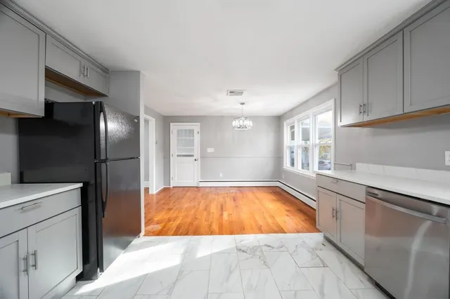 a kitchen with a sink and refrigerator