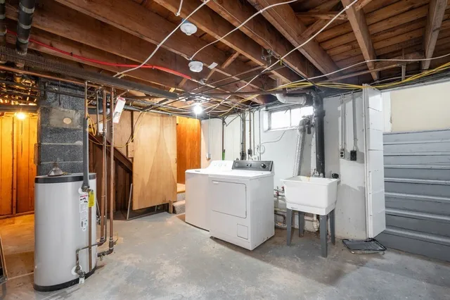 a view of a bathroom with a shower and a sink