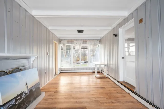 a view of entryway with wooden floor