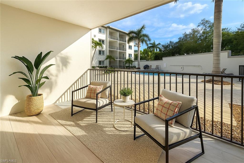 1100 Pine Ridge Road, Unit A106 Naples, FL 34108 - Photo 18 of 27 a view of balcony with furniture