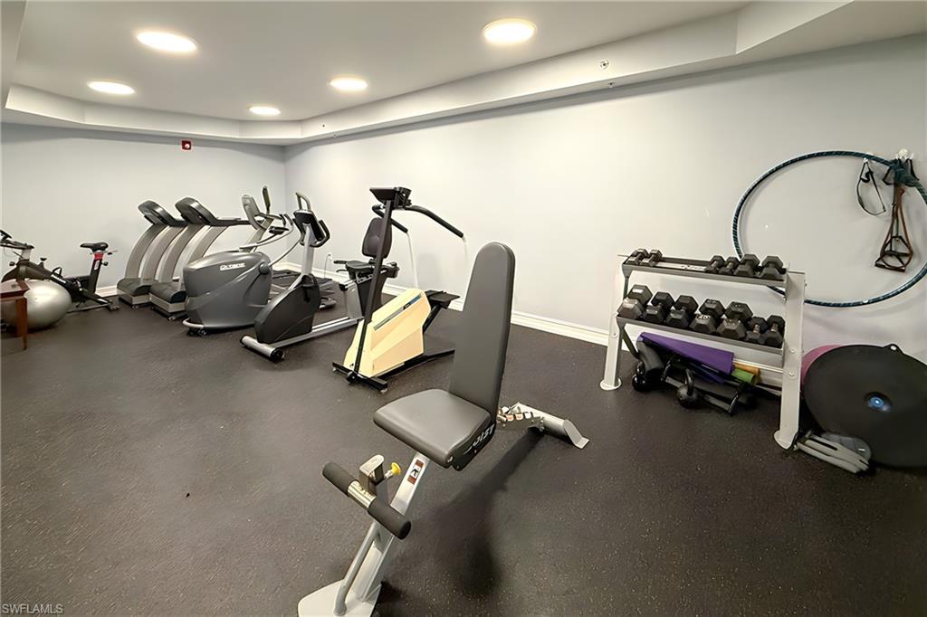 1100 Pine Ridge Road, Unit A106 Naples, FL 34108 - Photo 25 of 27 a view of a room with gym equipment