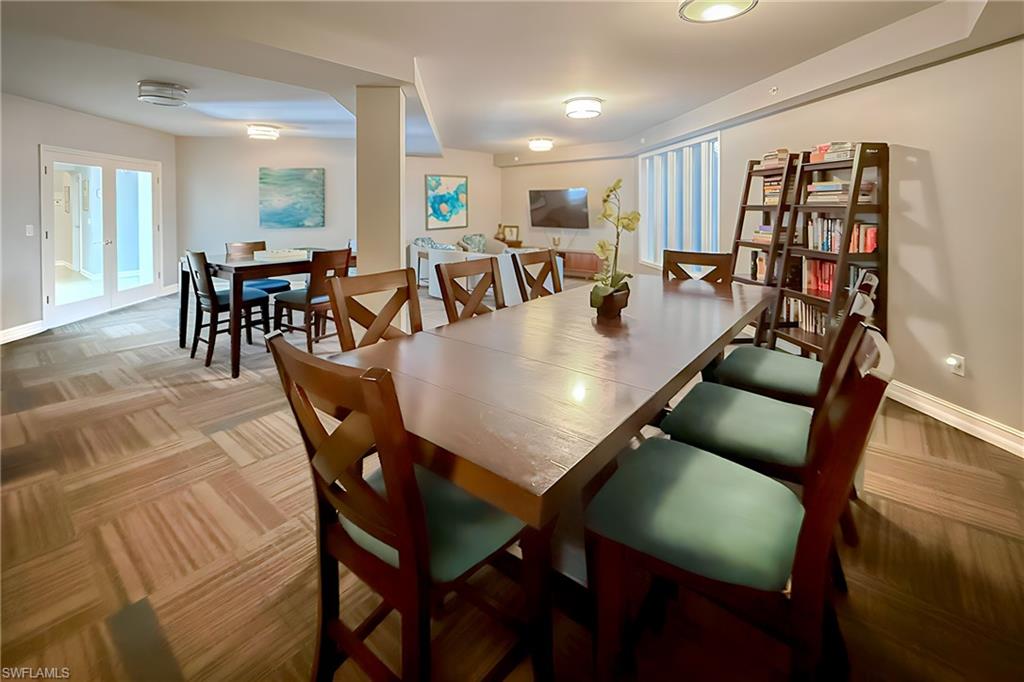 1100 Pine Ridge Road, Unit A106 Naples, FL 34108 - Photo 26 of 27 a view of a dining room with furniture