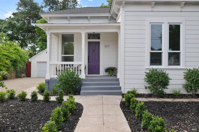 a front view of a house with garden