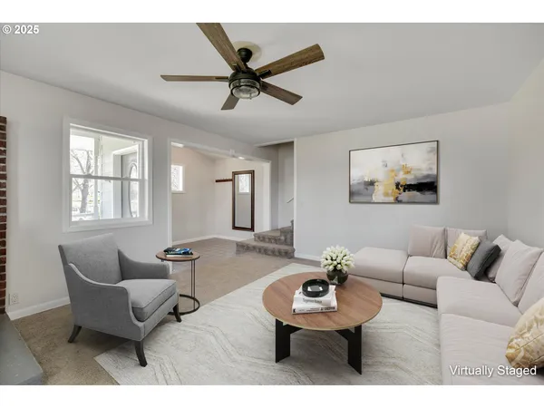 a living room with furniture and a window