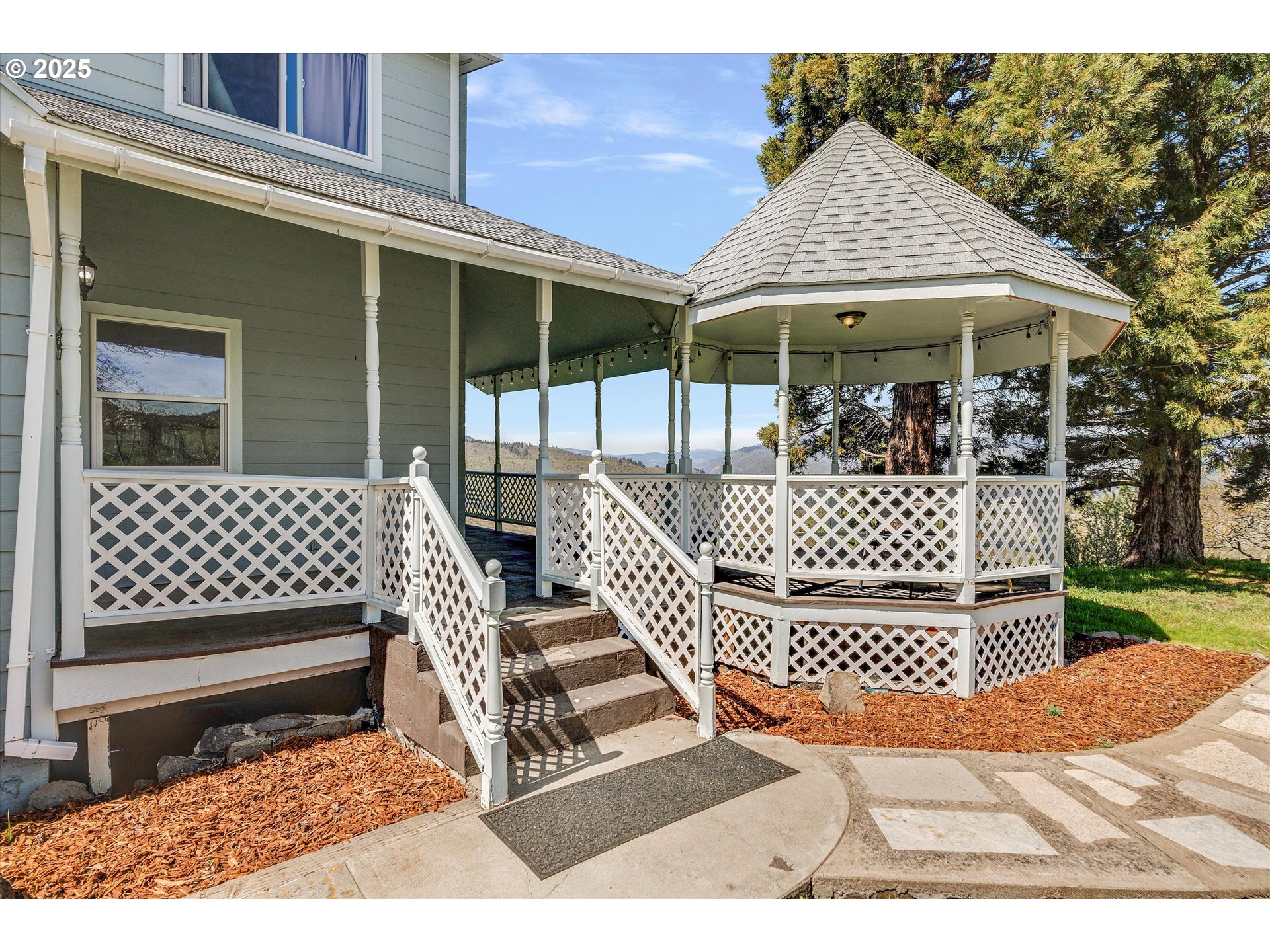 1805 Carroll Road Mosier, OR 97040 - Photo 10 of 45 a view of a chair and tables back yard of the house