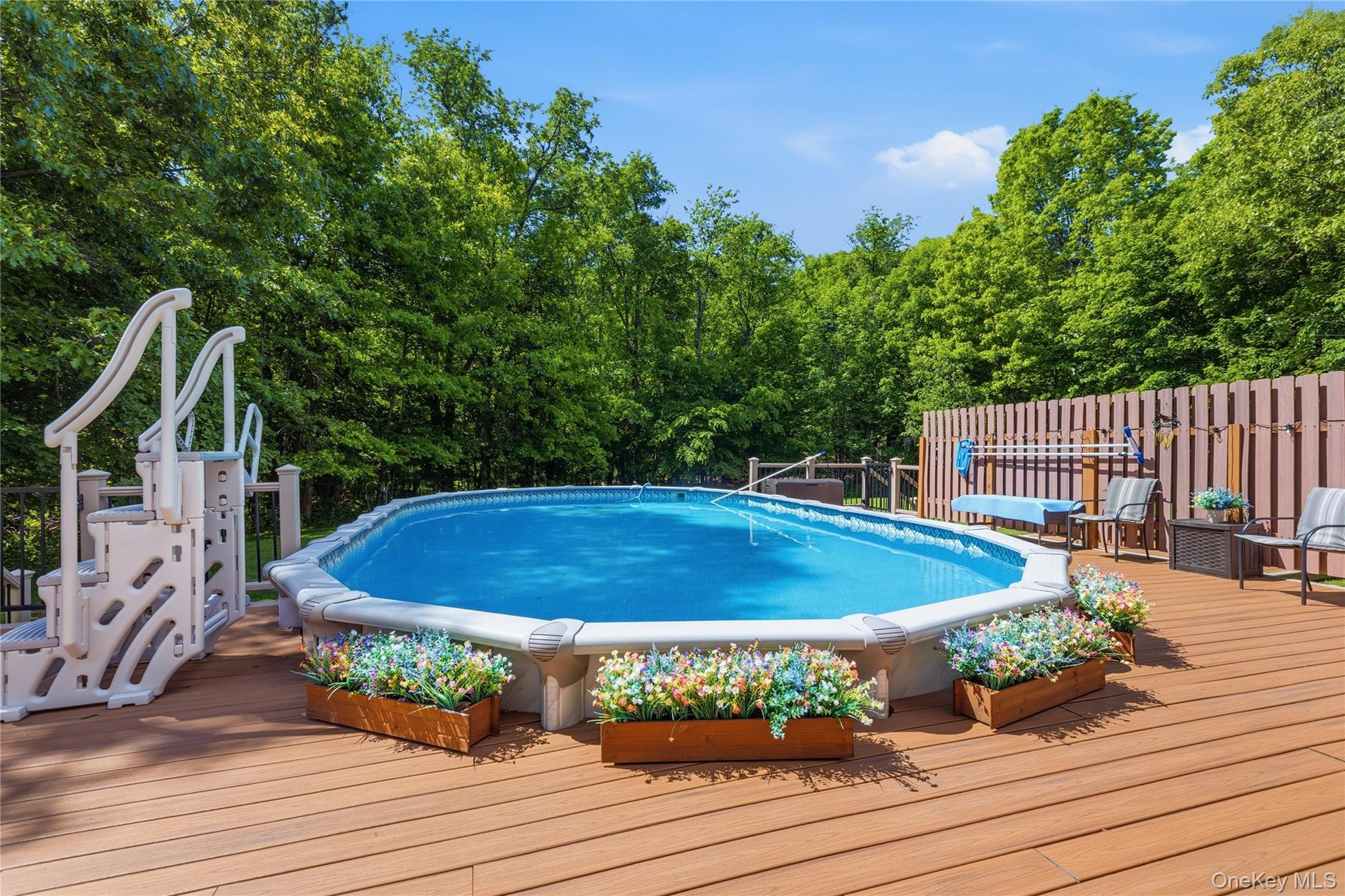 239-241 Fosler Road Highland, NY 12528 - Photo 22 of 42 Expansive outdoor deck featuring an above-ground pool with integrated entry steps