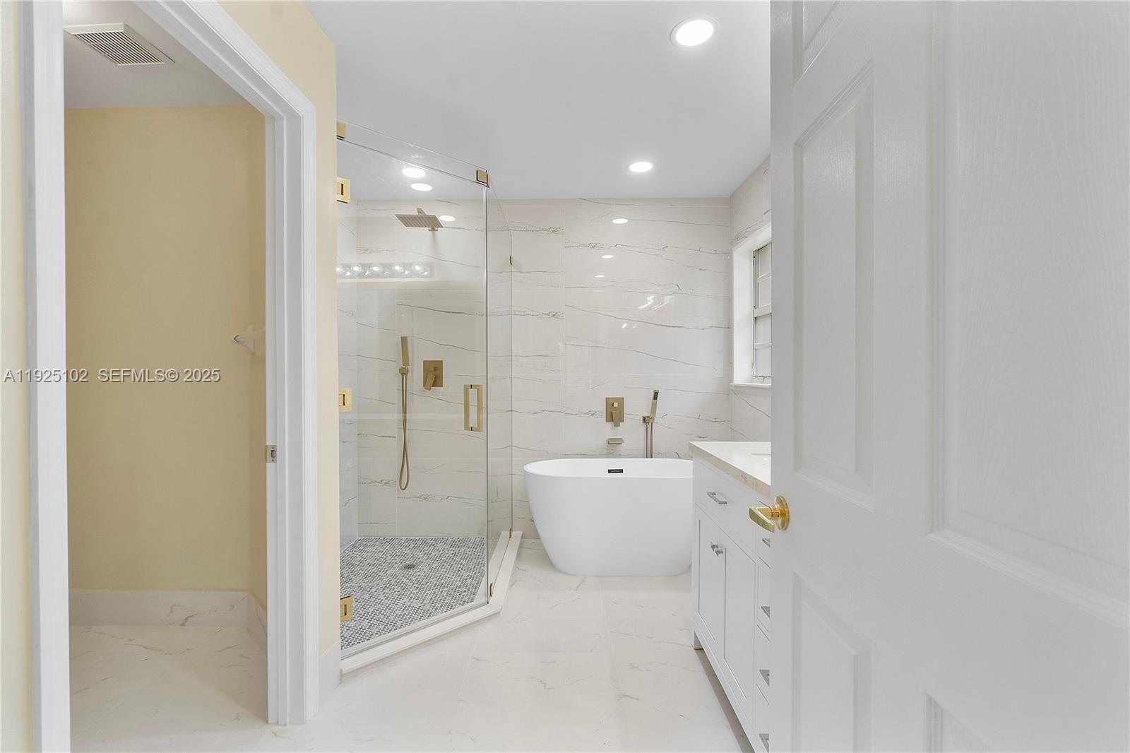 5310 Northwest 124th Way Coral Springs, FL 33076 - Photo 11 of 30 a bathroom with a bathtub shower and toilet