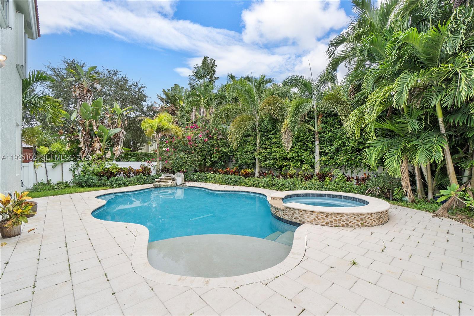 5310 Northwest 124th Way Coral Springs, FL 33076 - Photo 20 of 30 a view of a swimming pool and lounge chair