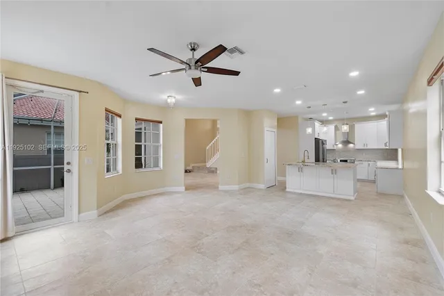 a view of a livingroom with a kitchen