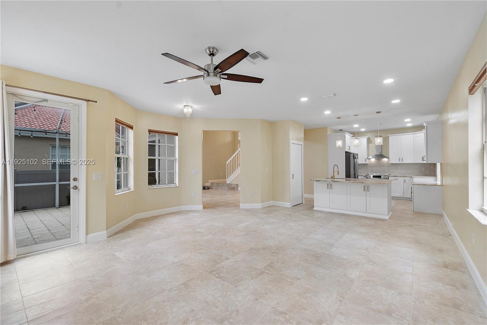 5310 Northwest 124th Way Coral Springs, FL 33076 - Photo 8 of 30 a view of a livingroom with a kitchen
