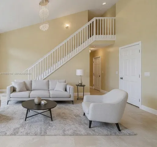 a living room with furniture and a rug