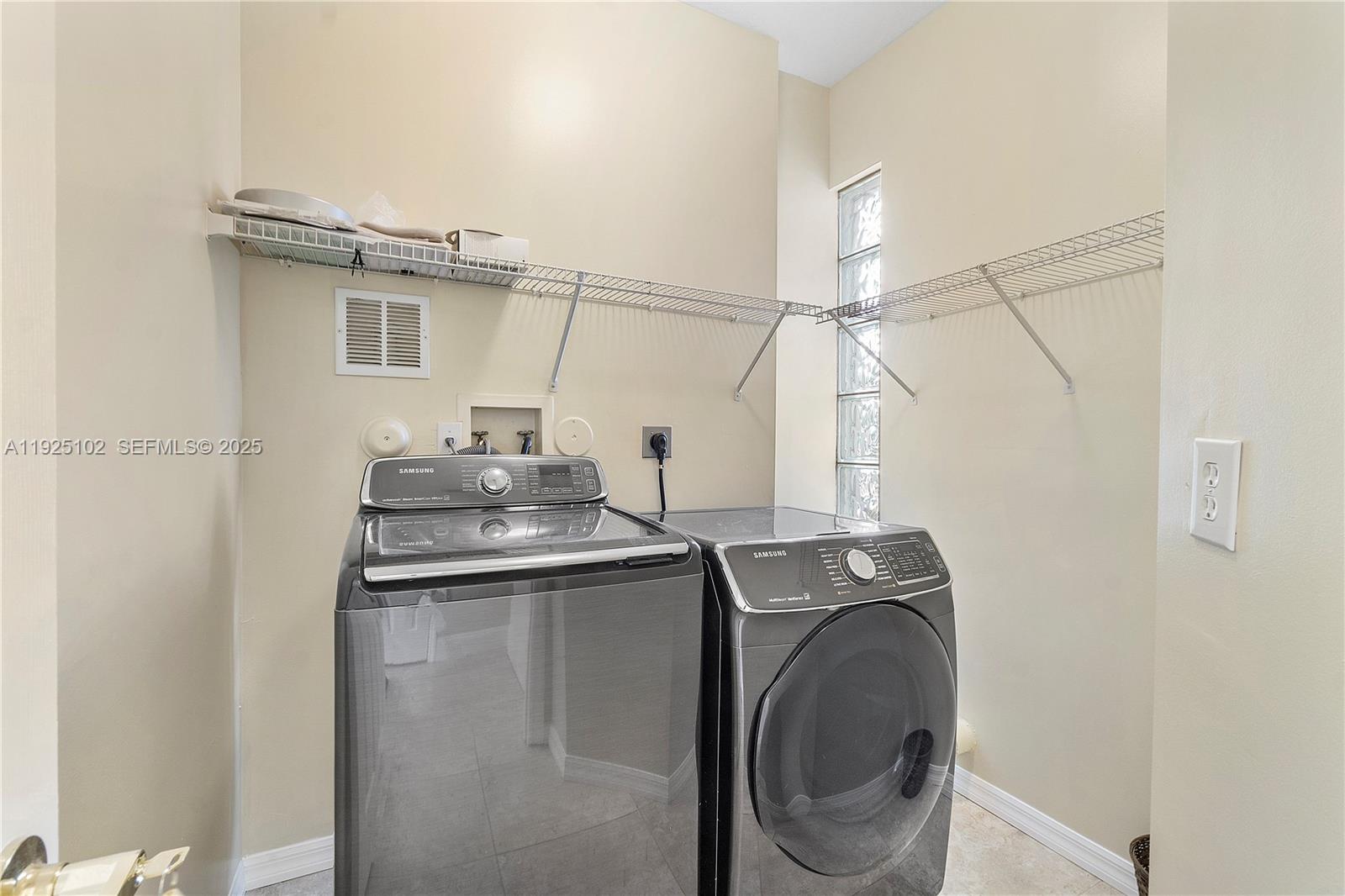 5310 Northwest 124th Way Coral Springs, FL 33076 - Photo 10 of 30 a utility room with dryer and washer