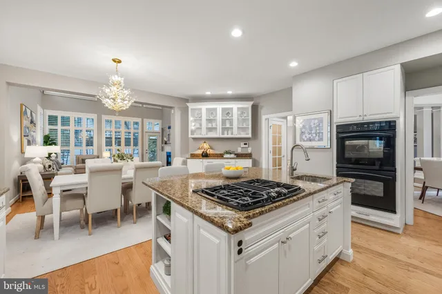 a living room with furniture and floor to ceiling windows
