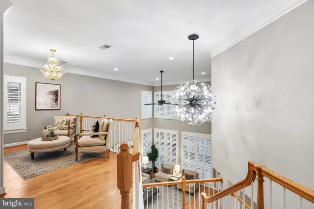 a bedroom with a bed and ceiling fan