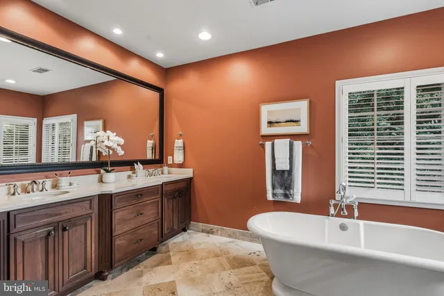 a bedroom with bed and a window