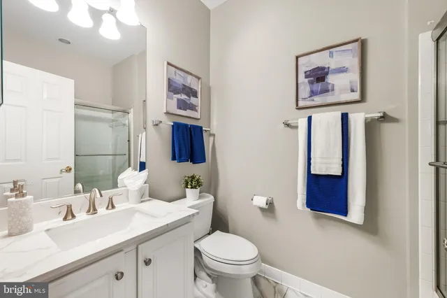 a view of a livingroom with a ceiling fan and window