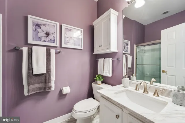 a kitchen with granite countertop a sink and a stove