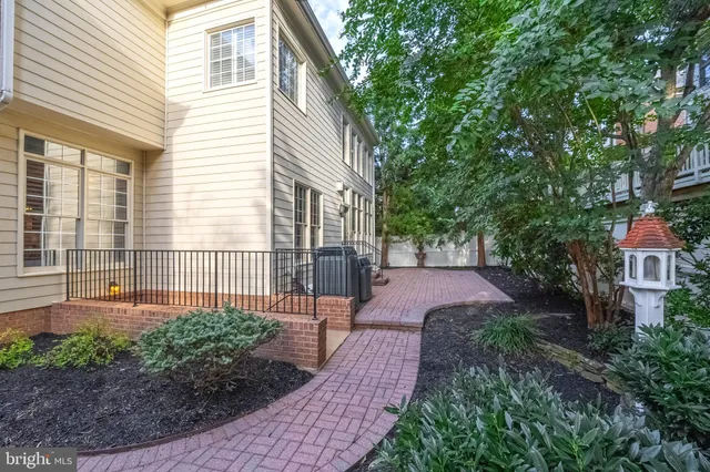 a view of a patio with a table and chairs