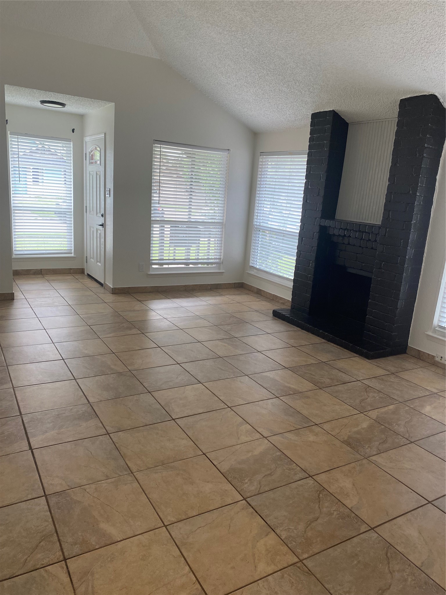 3107 Raccoon Run Spring, TX 77373 - Photo 27 of 35 Living room high ceiling and fire place