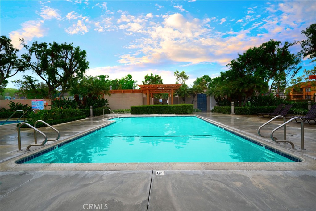 155 Oxford, Unit 37 Irvine, CA 92612 - Photo 18 of 33 a view of a backyard with swimming pool