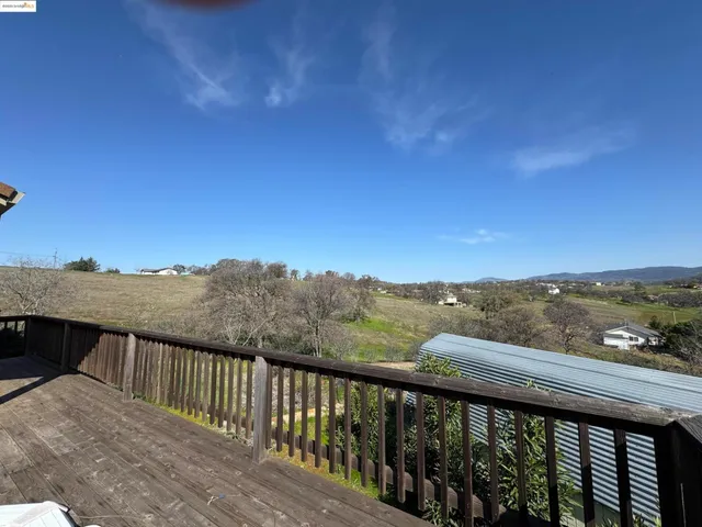 a balcony with an outdoor space