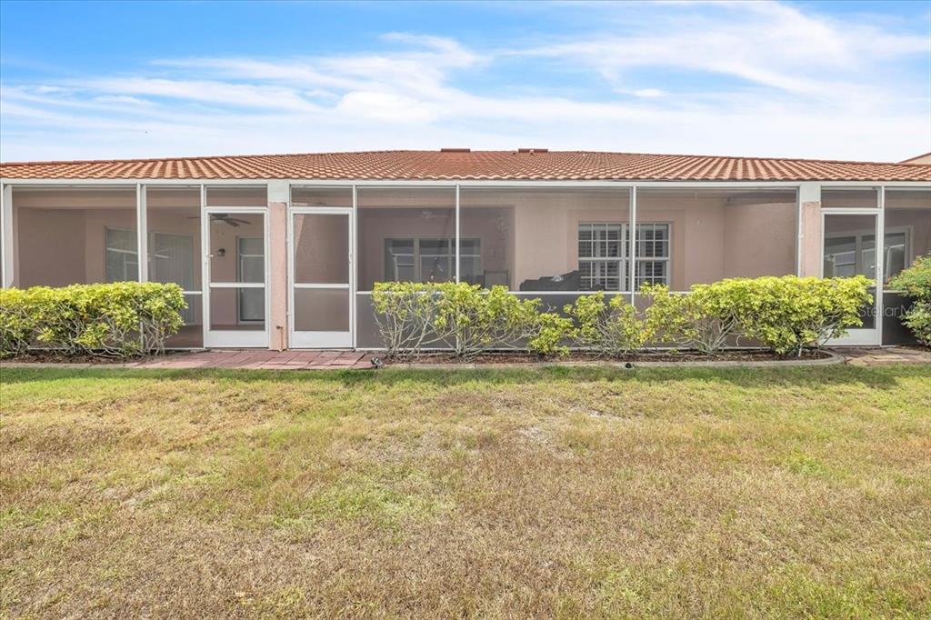 1260 Rio De Janeiro Avenue, Unit 102 Punta Gorda, FL 33983 - Photo 35 of 46 front view of a house with a yard