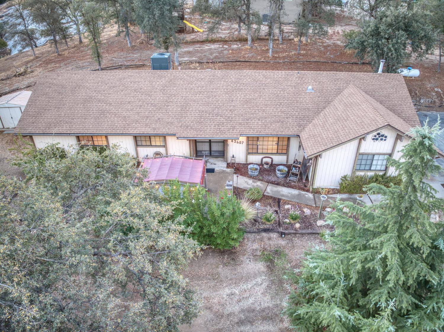 42607 Long Hollow Drive Coarsegold, CA 93614 - Photo 19 of 52 an aerial view of a house with a yard and a large tree
