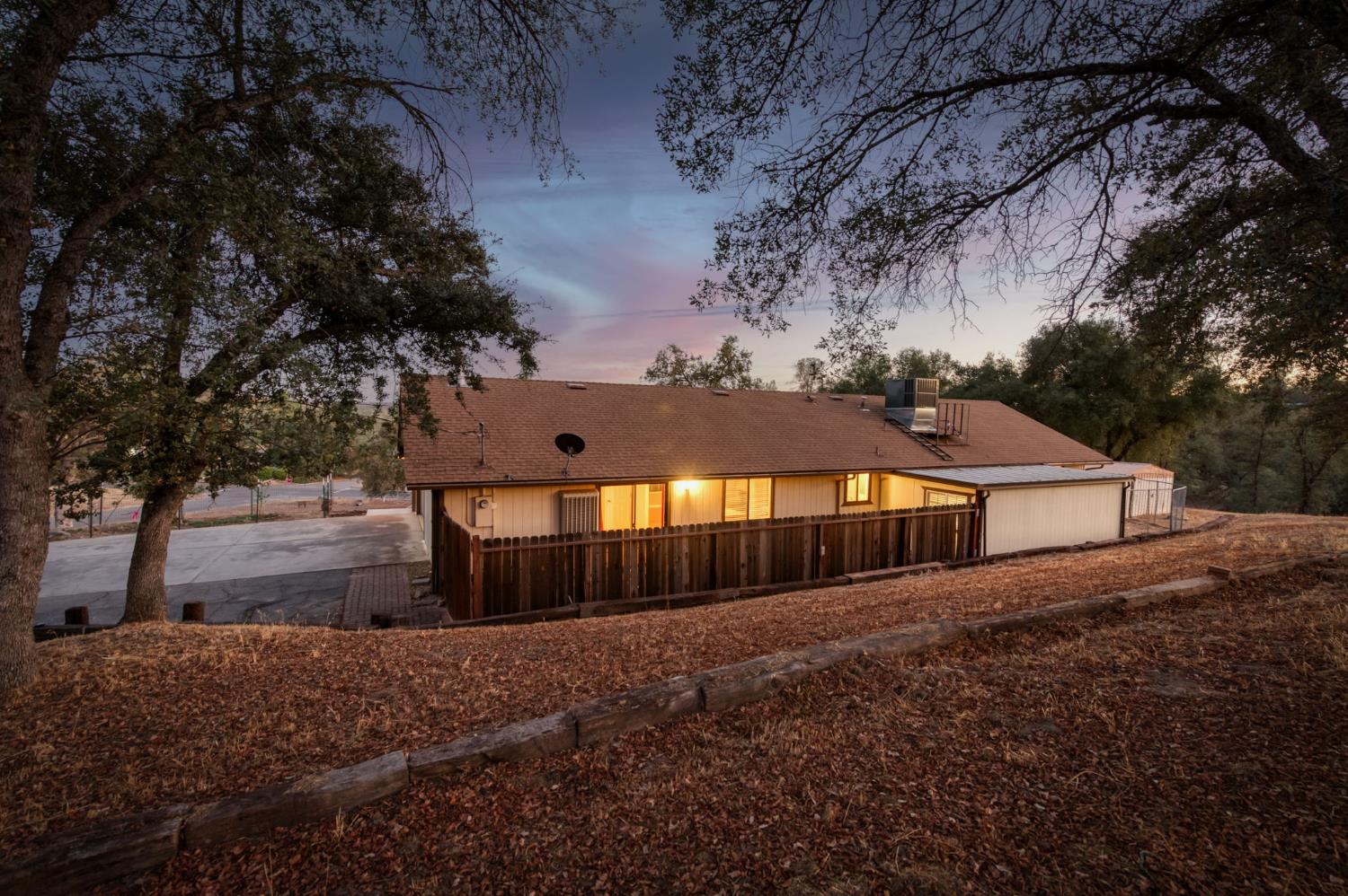 42607 Long Hollow Drive Coarsegold, CA 93614 - Photo 20 of 52 a front view of a house with a yard