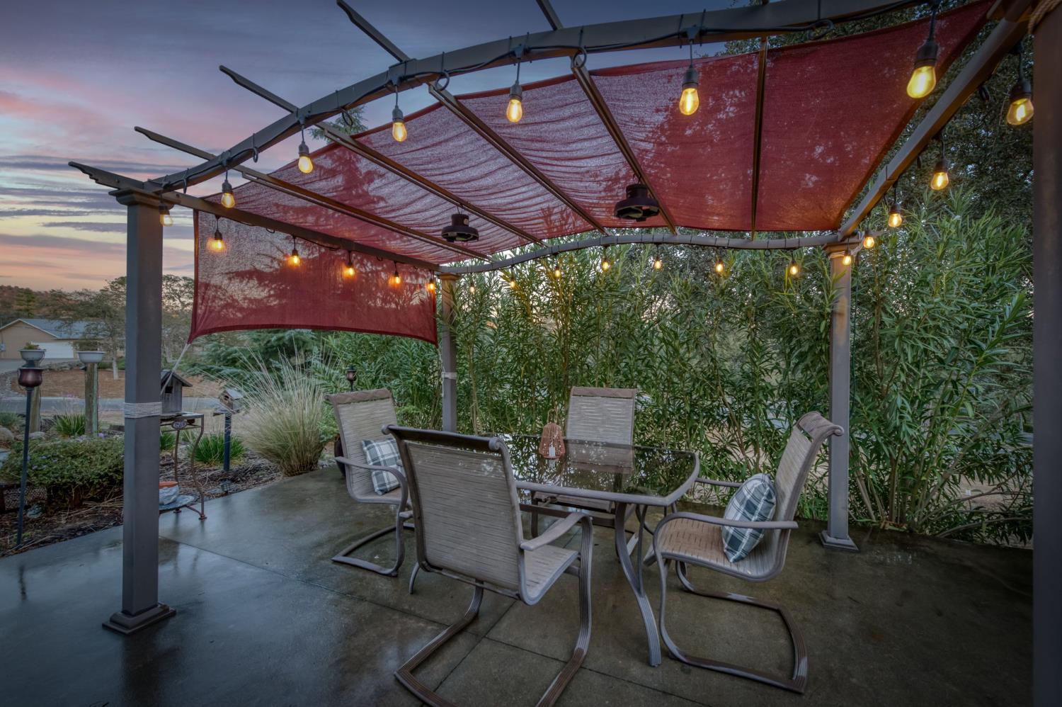 42607 Long Hollow Drive Coarsegold, CA 93614 - Photo 21 of 52 a patio with table and chairs with potted plants