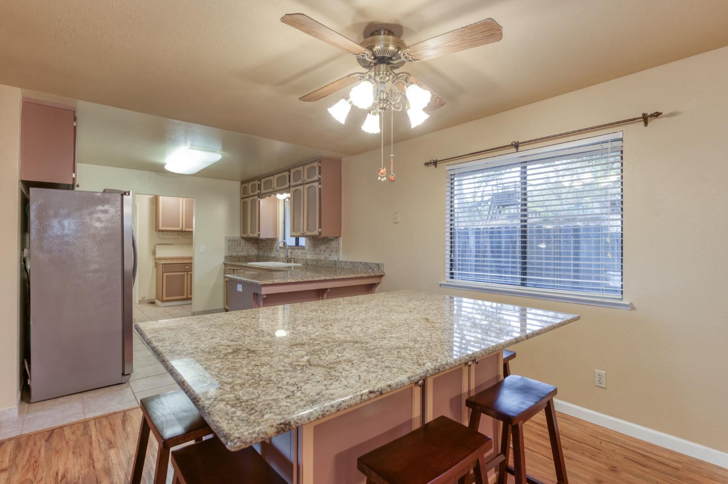 42607 Long Hollow Drive Coarsegold, CA 93614 - Photo 23 of 52 a kitchen with center island and stainless steel appliances