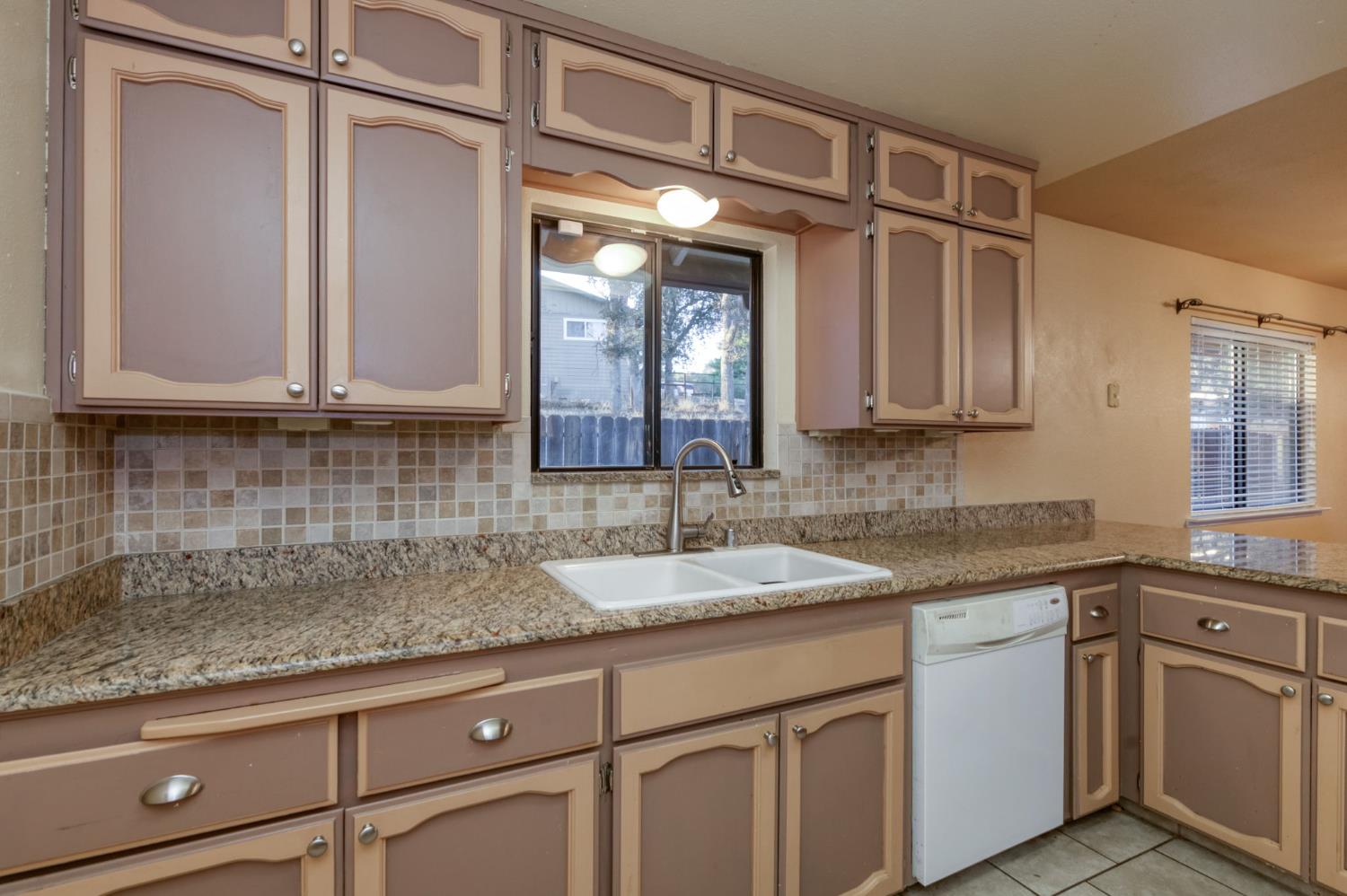 42607 Long Hollow Drive Coarsegold, CA 93614 - Photo 28 of 52 a kitchen with stainless steel appliances granite countertop a sink and cabinets with wooden floor