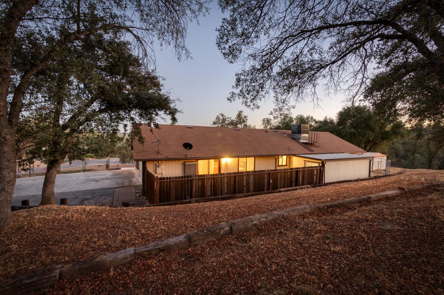 42607 Long Hollow Drive Coarsegold, CA 93614 - Photo 33 of 52 a front view of a house with a yard