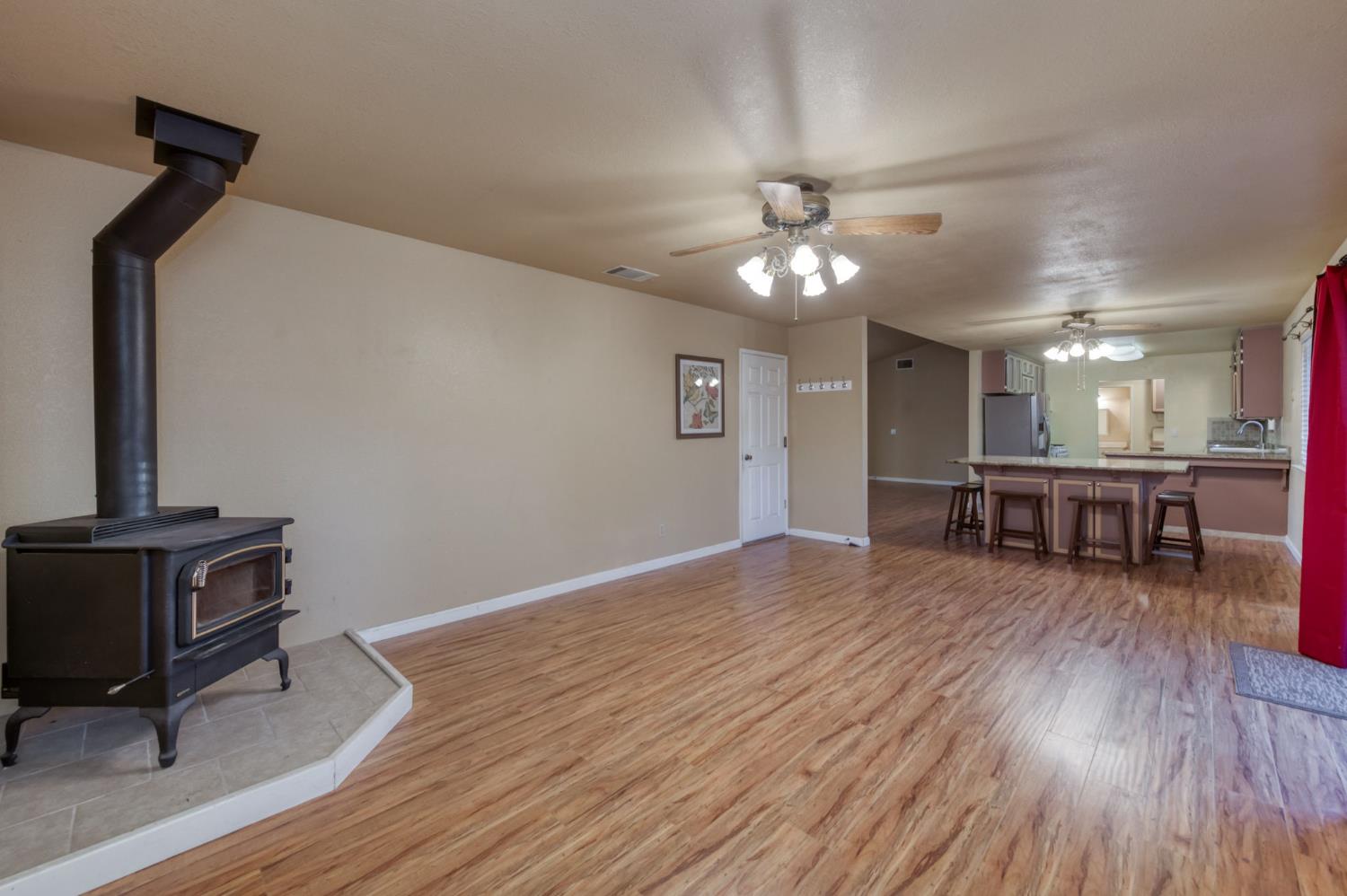 42607 Long Hollow Drive Coarsegold, CA 93614 - Photo 46 of 52 a living room with furniture and wooden floor