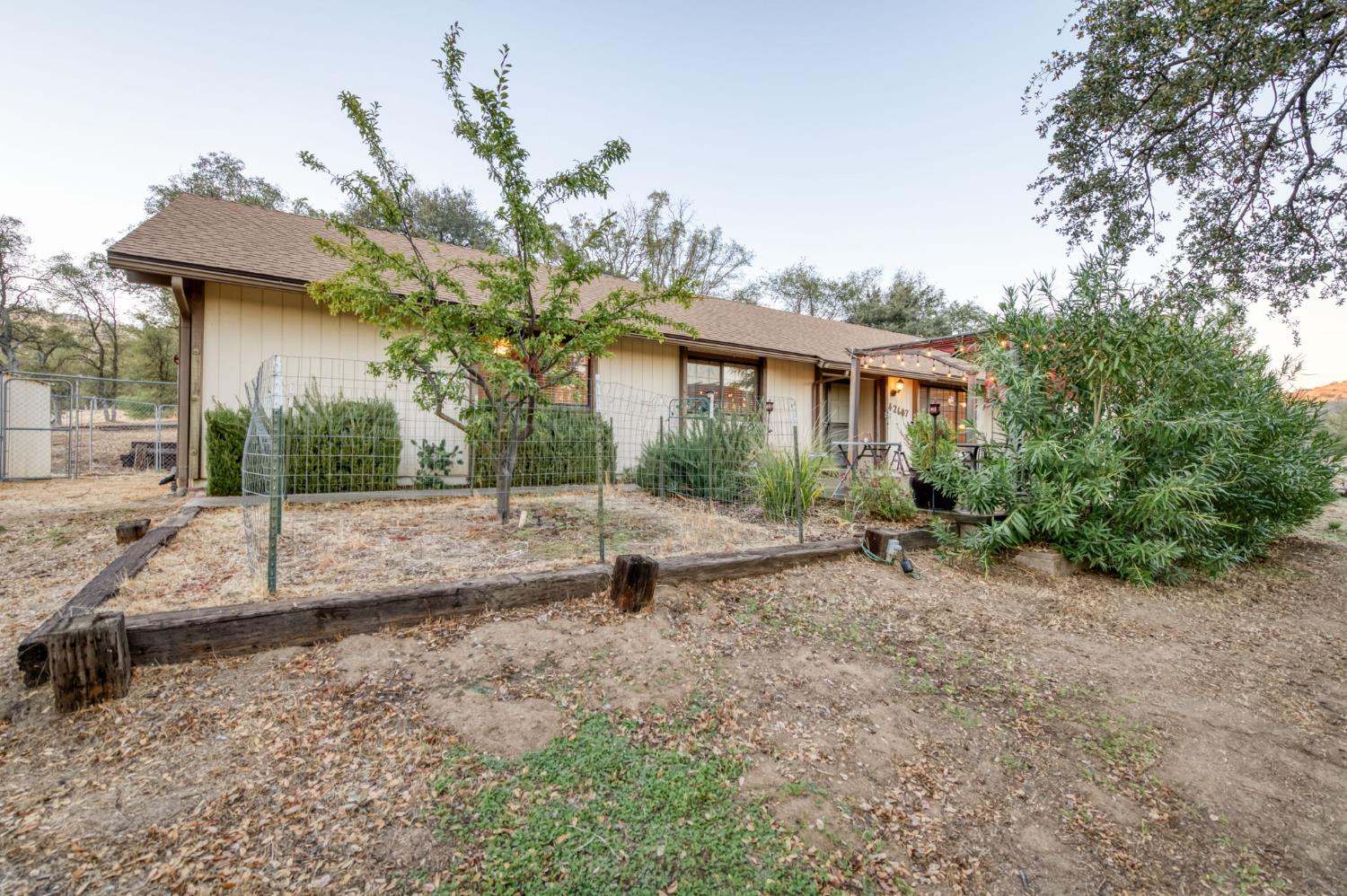 42607 Long Hollow Drive Coarsegold, CA 93614 - Photo 51 of 52 a view of a house with a yard and a tree