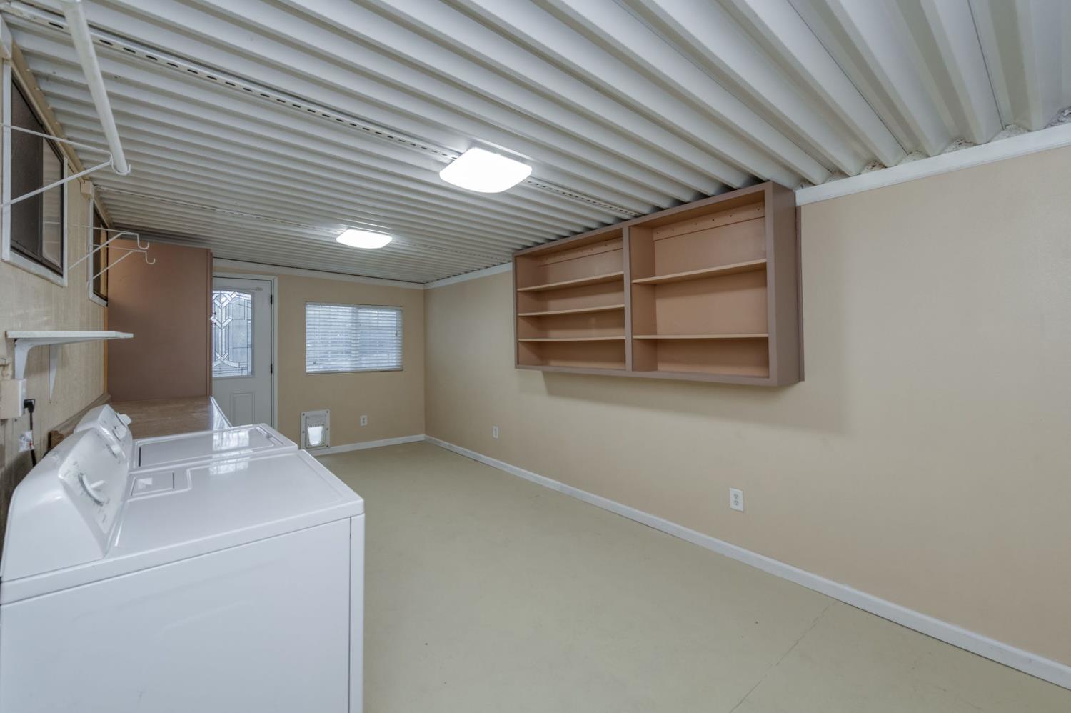 42607 Long Hollow Drive Coarsegold, CA 93614 - Photo 10 of 52 a view of workspace with washer and dryer