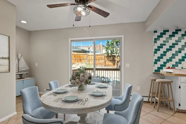 a dining room with furniture and window