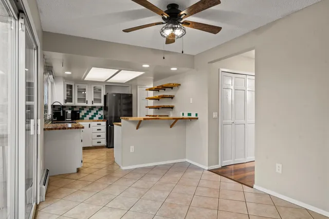 a view of open kitchen with windows