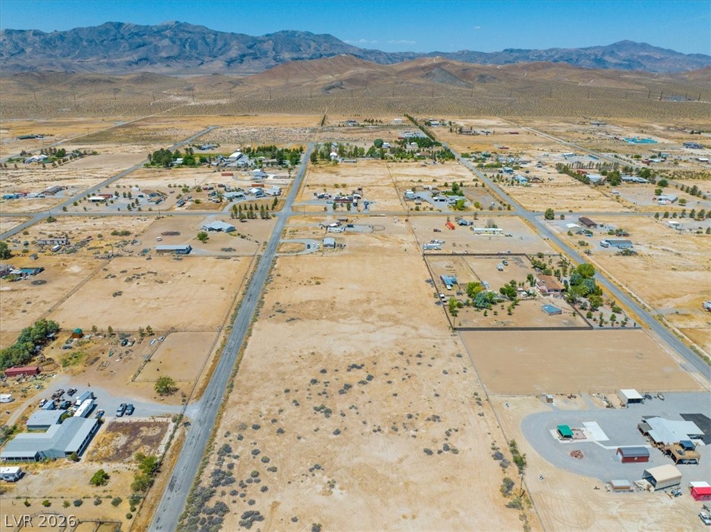 4580 Lawrence Road Pahrump, NV 89048 - Photo 35 of 40 Panoramic desert landscapes and mountain vistas define this expansive residential lot.