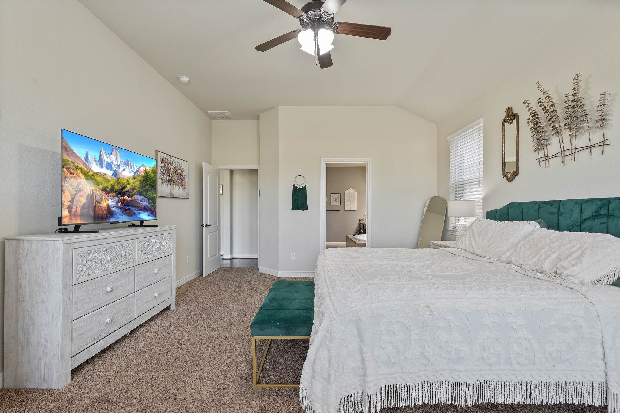 10114 North Whimbrel Circle Conroe, TX 77385 - Photo 21 of 50 a bedroom with a bed and a flat screen tv