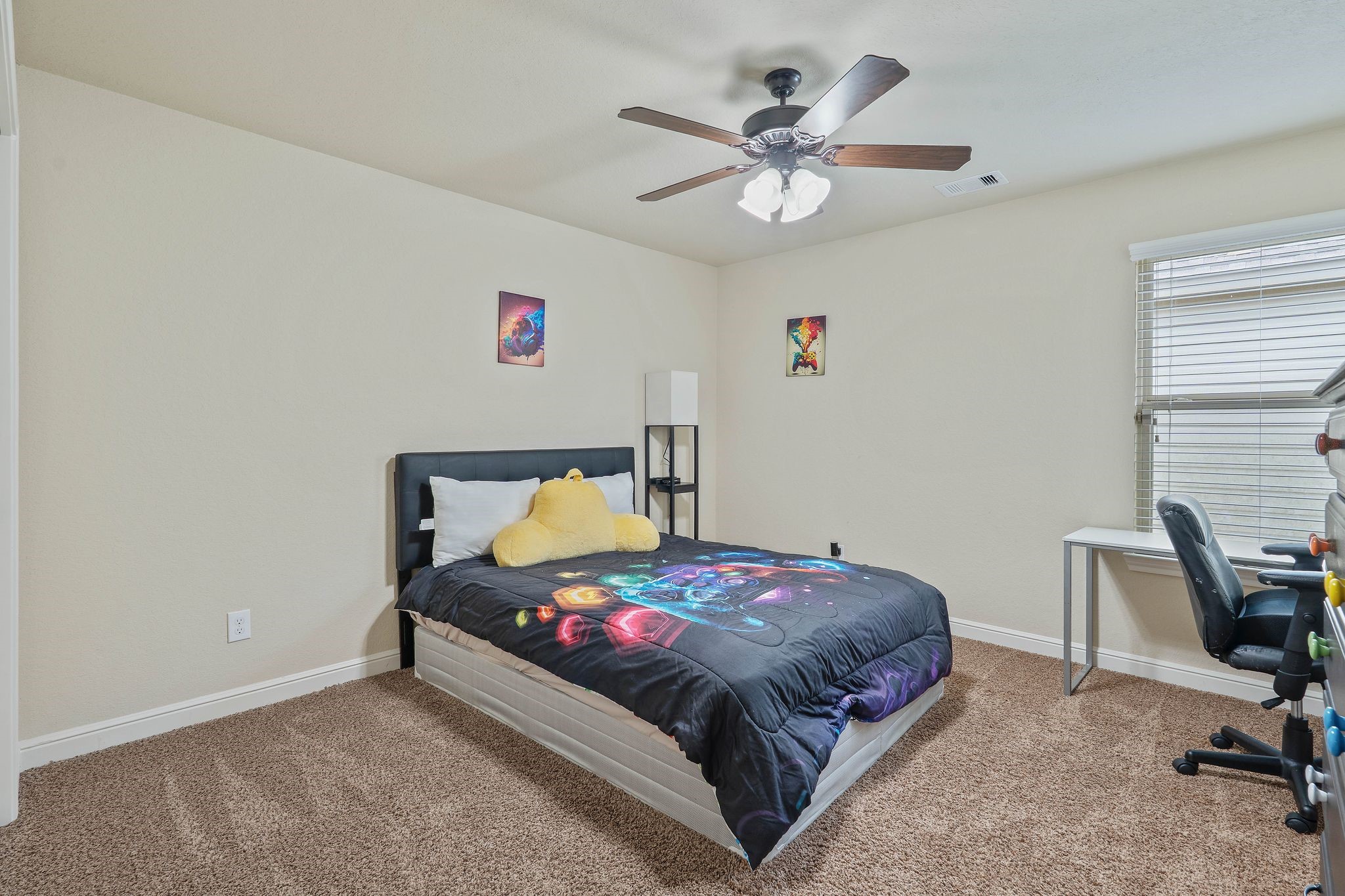 10114 North Whimbrel Circle Conroe, TX 77385 - Photo 35 of 50 a bedroom with a bed and a chandelier