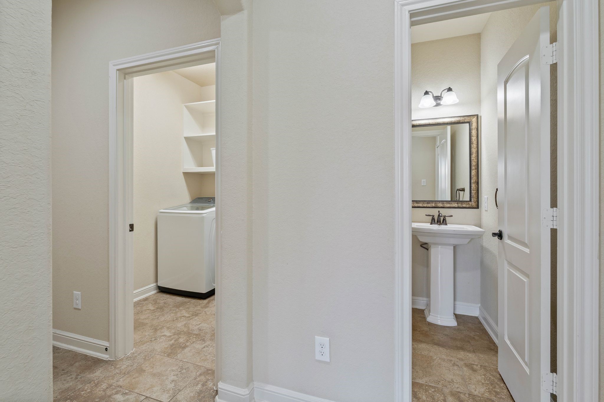 10114 North Whimbrel Circle Conroe, TX 77385 - Photo 7 of 50 a view of a bathroom from a corridor