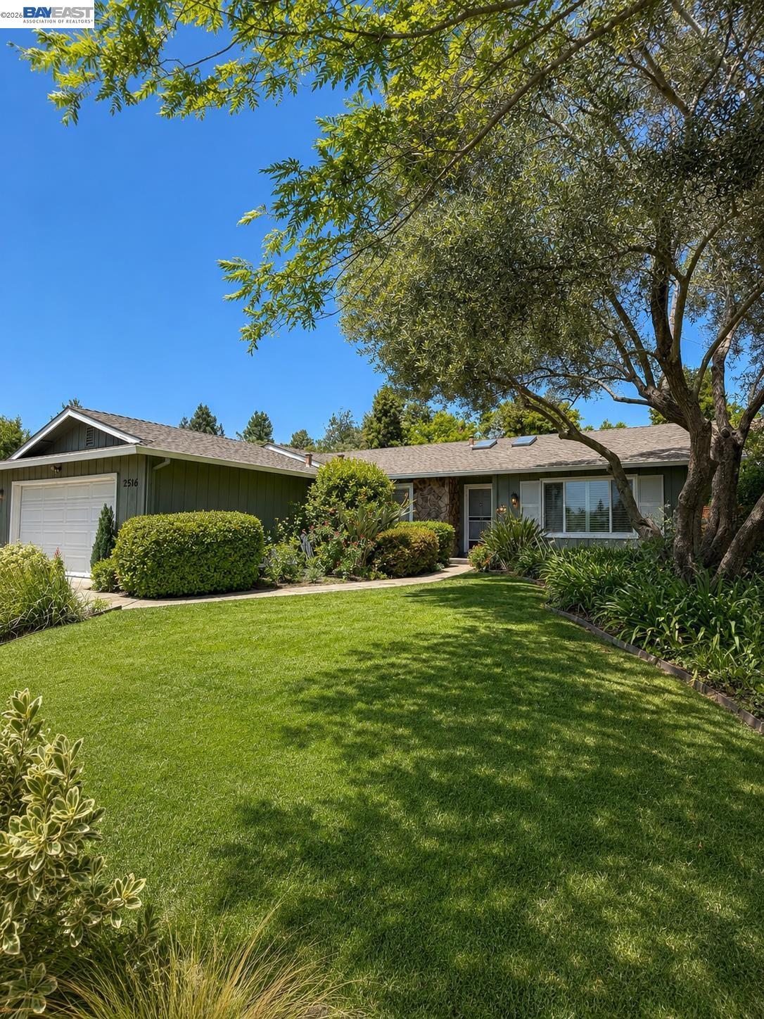 2516 Dos Rios Drive San Ramon, CA 94583 - Photo 2 of 14 a front view of a house with a garden