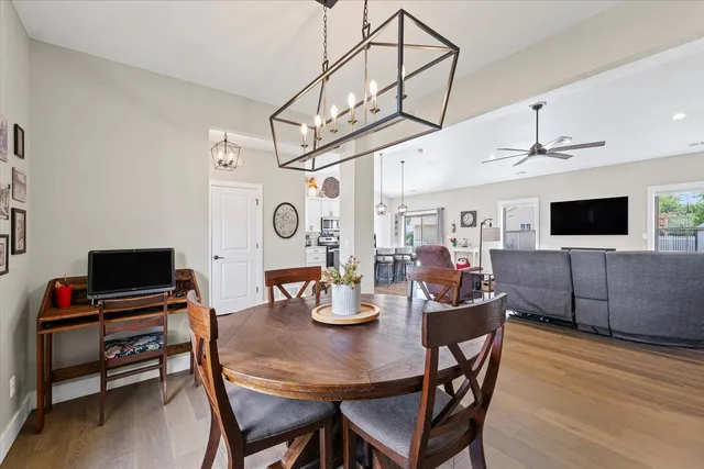 a view of a dining room with furniture and wooden floor