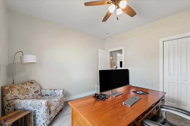 a workspace with furniture and window