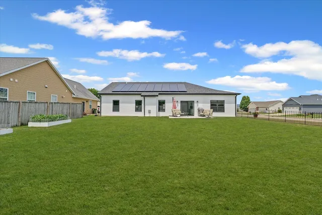 a front view of house with yard and green space